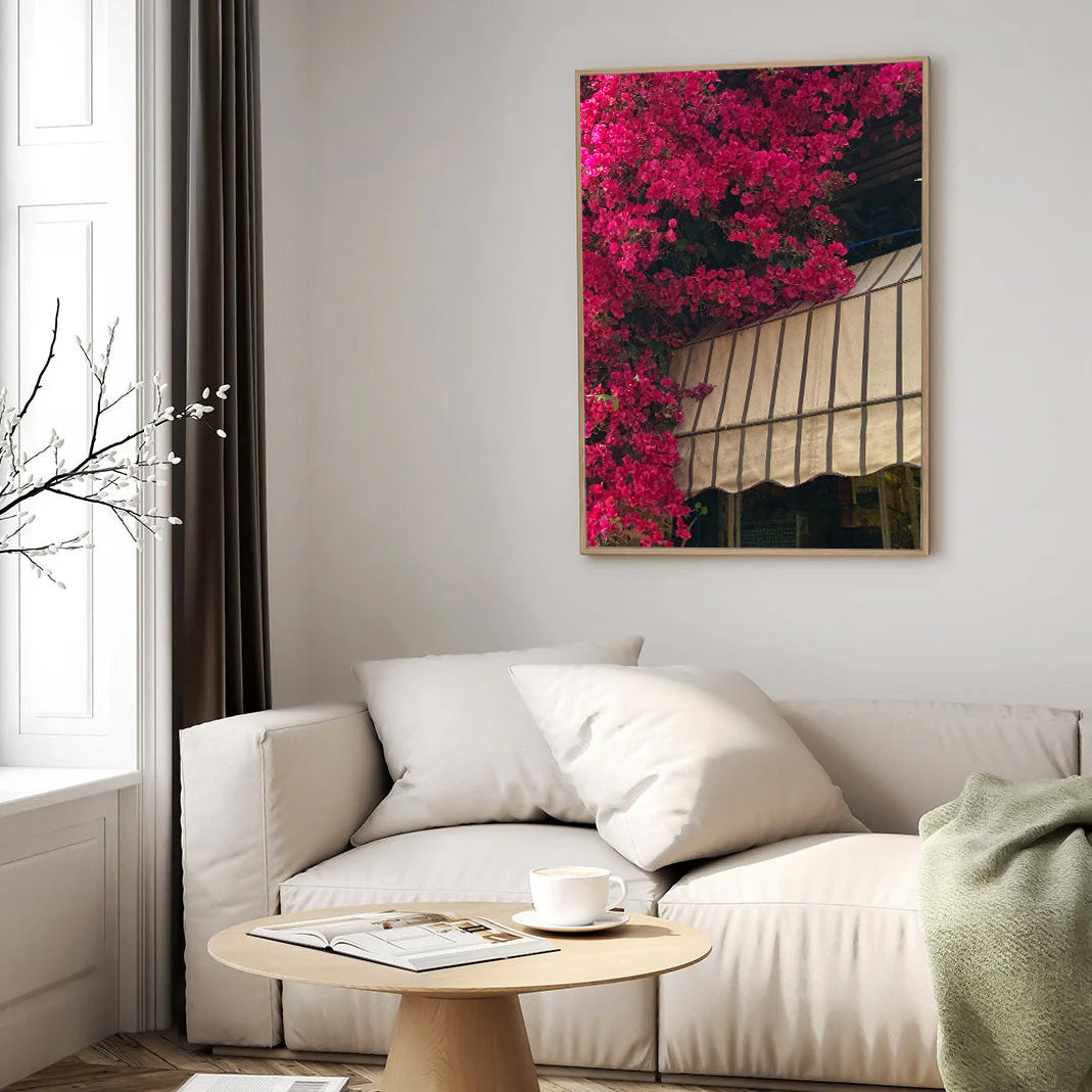 Cafe Levinski photography print featuring vibrant pink bougainvillea and a striped awning in Tel Aviv.