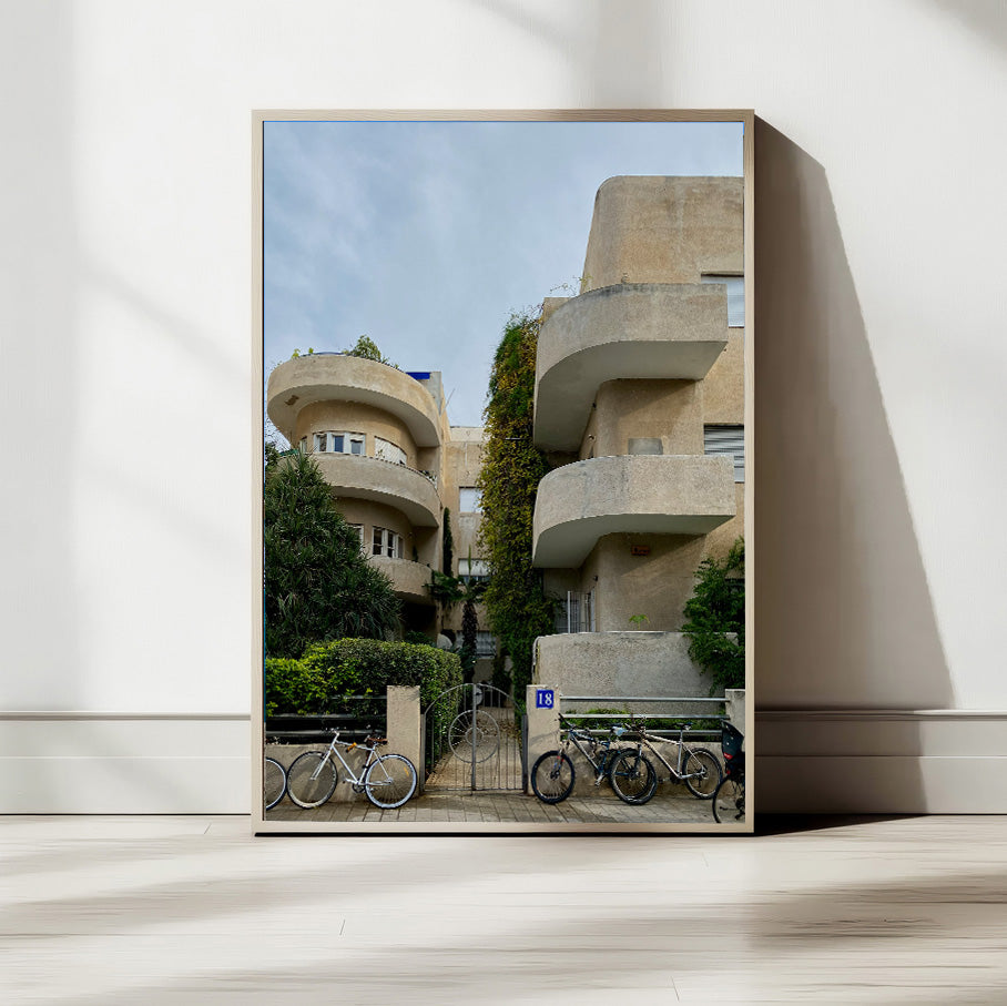 Bauhaus Tel Aviv architecture featuring curved balconies and greenery in Tel Aviv, Israel, ideal for wall art.