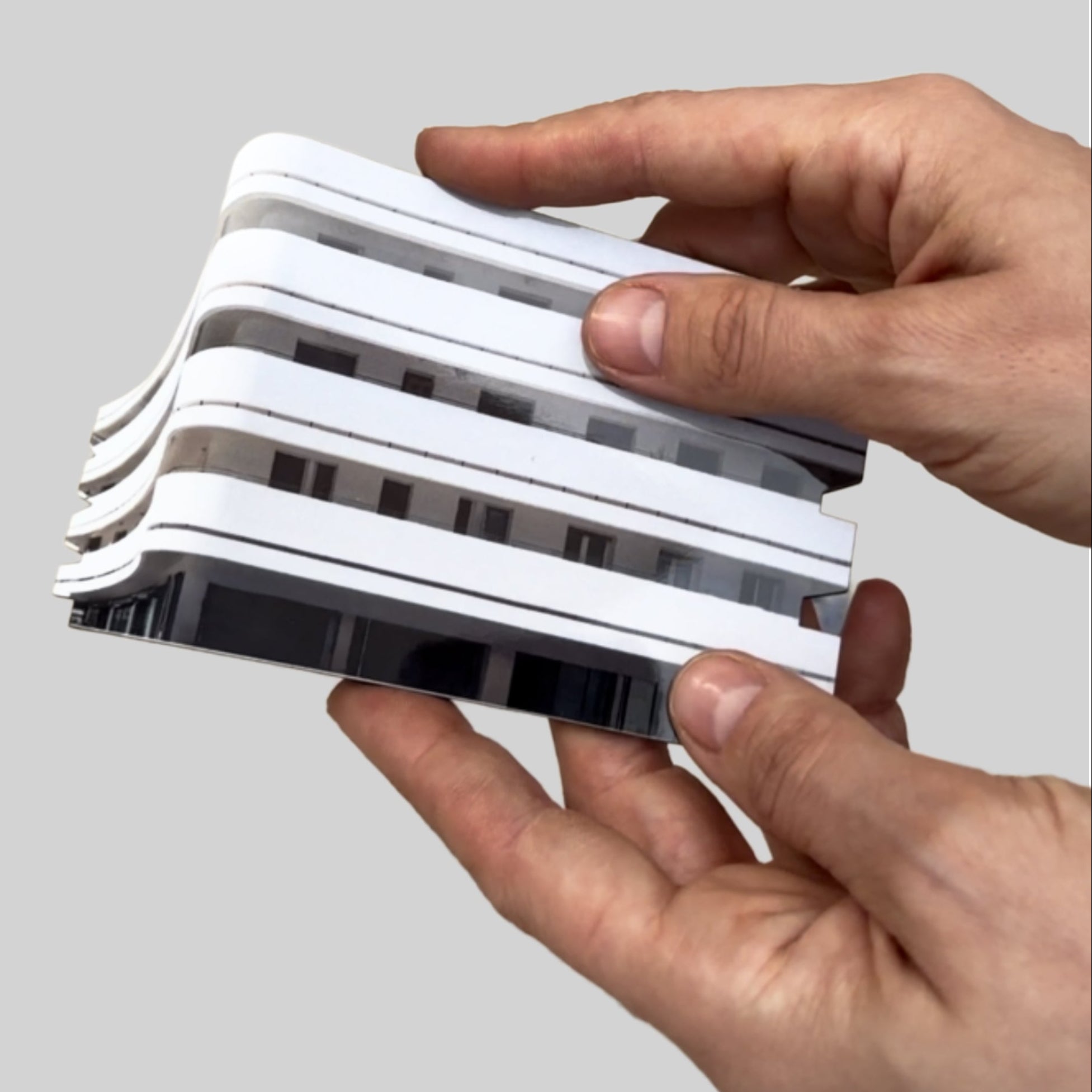 Image of hands holding a miniature from THIS IS TEL AVIV Israel Souvenir — Architecture Miniature set, showcasing modern design.