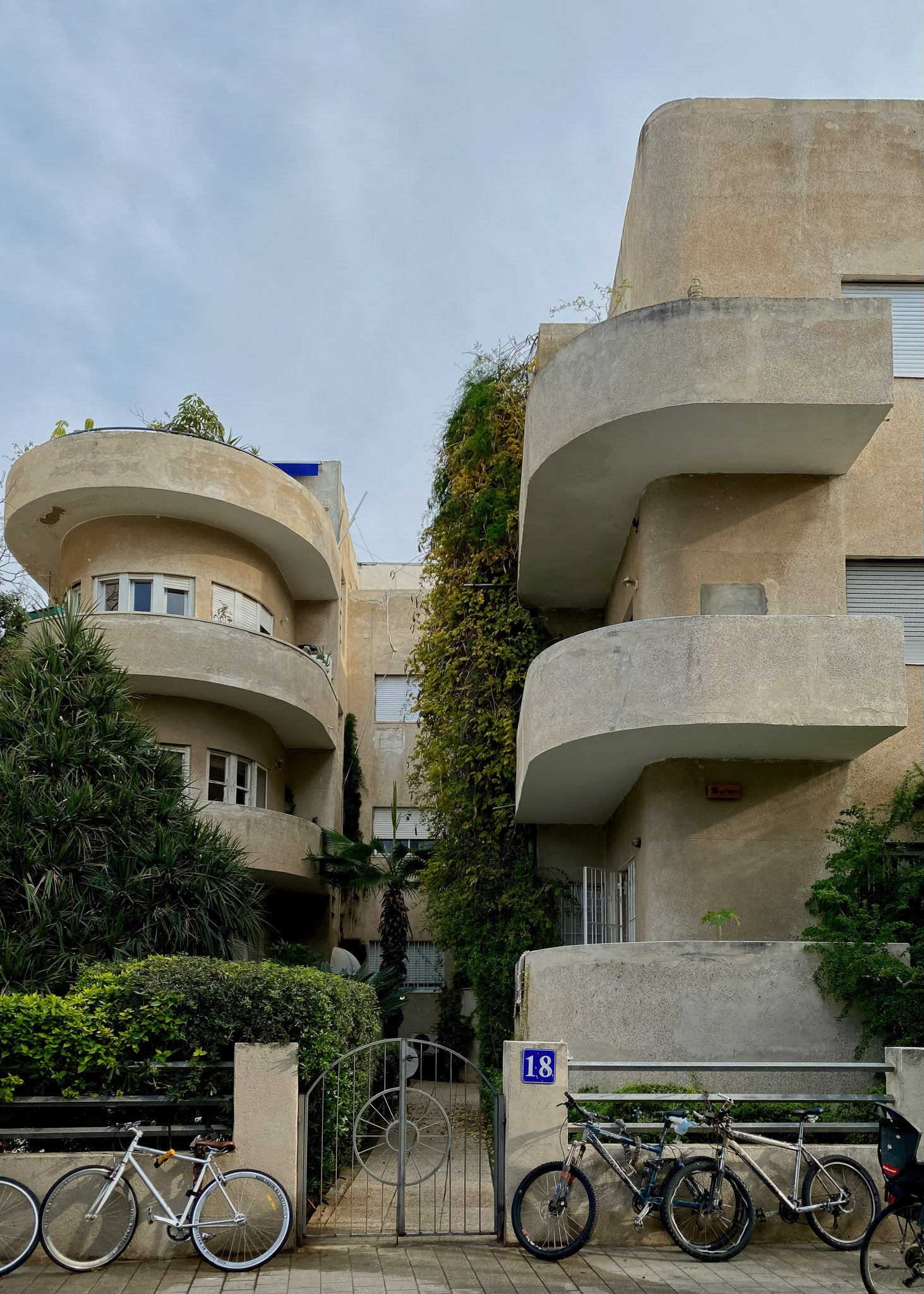 Printed Poster featuring modern architecture with curved balconies and bicycles in front of a residential building.