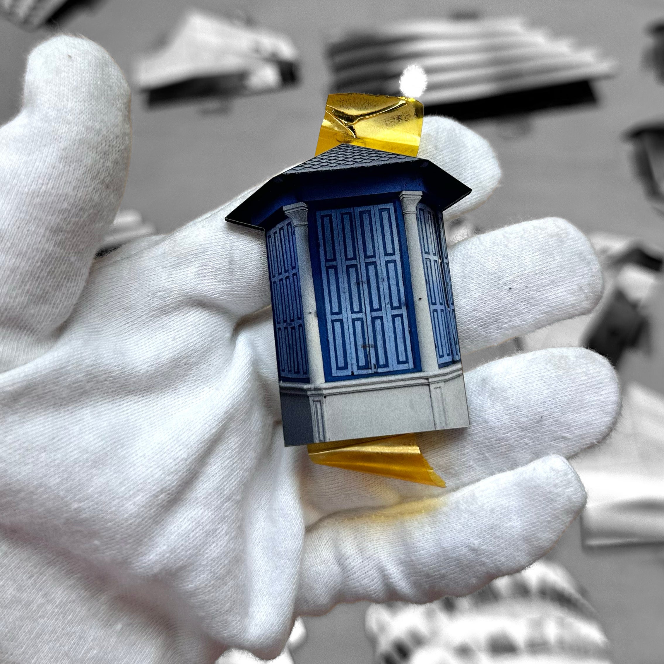 THIS IS TEL AVIV Israel Souvenir — Architecture Miniature in hand, showcasing blue architectural detail.