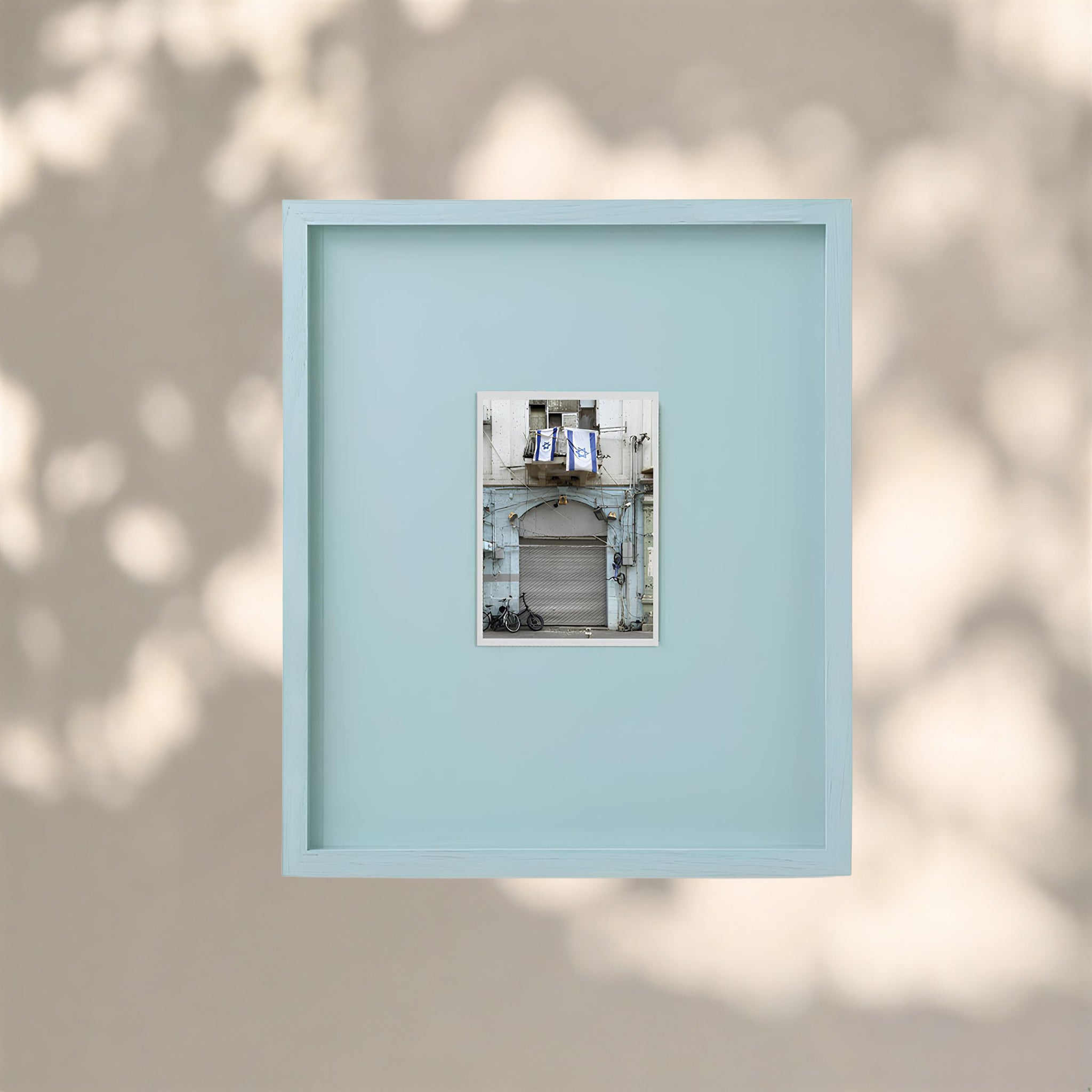 Letter from Tel Aviv collectible photo print in a light blue frame showcasing a Tel Aviv street.