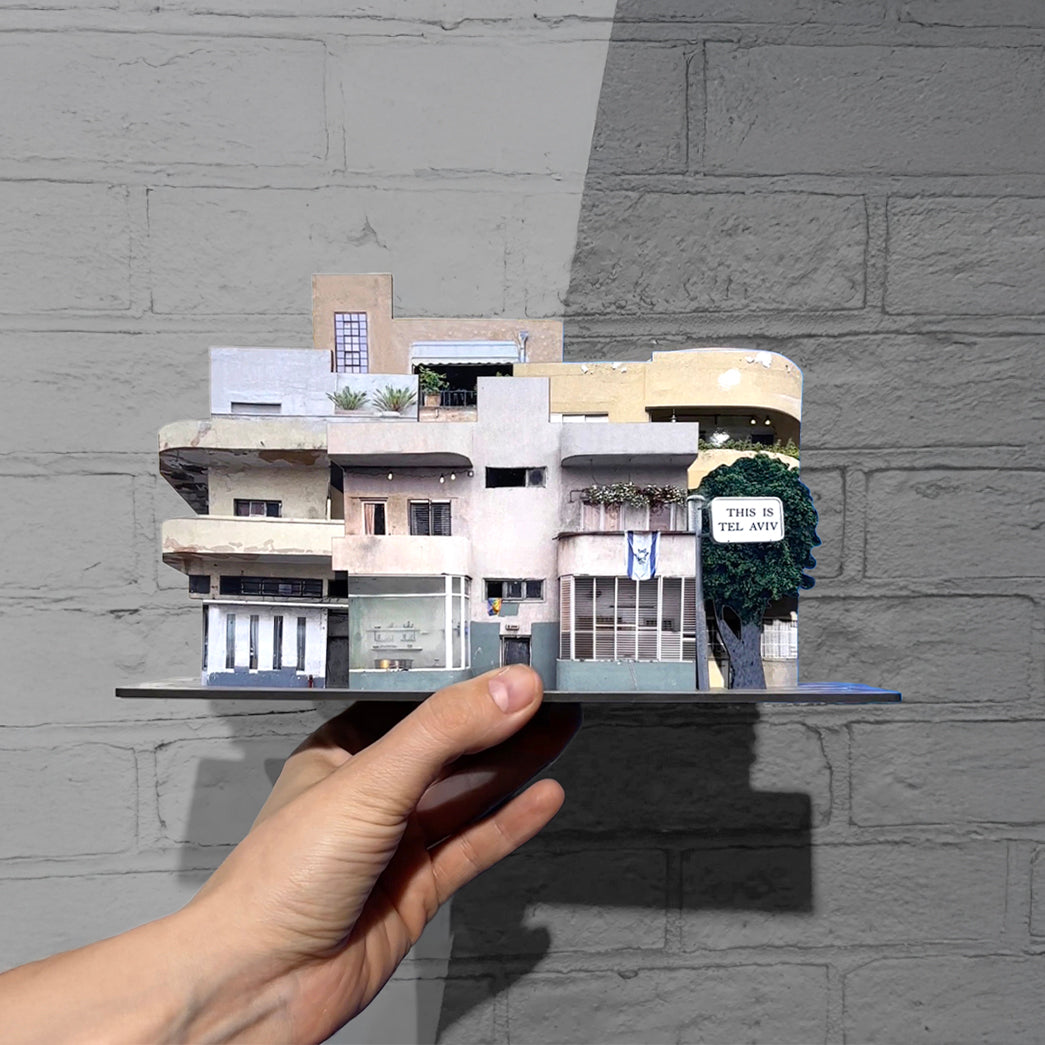 THIS IS TEL AVIV Israel Souvenir — Architecture Miniature set held in hand, showcasing charming urban structures.