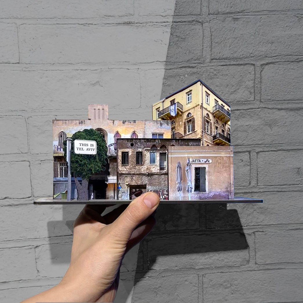 THIS IS TEL AVIV Israel Souvenir — City Miniature displayed in hand, showcasing iconic architecture from Tel Aviv.
