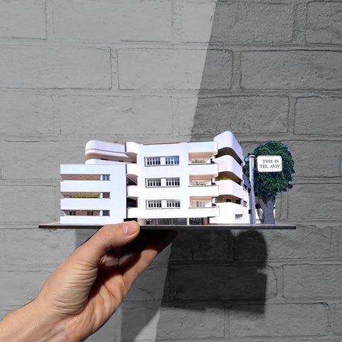 THIS IS TEL AVIV Israel Souvenir — Bauhaus Miniature Set being held, showcasing iconic Bauhaus architecture.