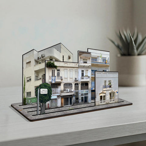 THIS IS TEL AVIV — Wooden Miniature showcasing white buildings and urban charm of Tel Aviv on a desk.